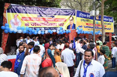 NEW DELHI, INDIA - APRIL 14, 2024: People celebrate during the 134th birth anniversary of Baba Bhimrao Ramji Ambedkar Jyanti, at Parliament Street, on April 14, 2024 in New Delhi, India.  clipart