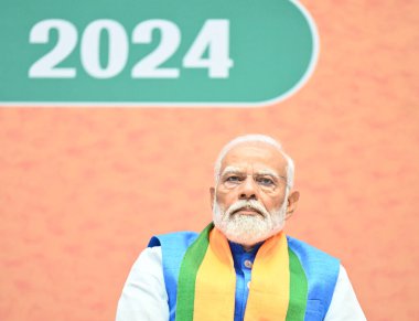 NEW DELHI, INDIA - APRIL 14, 2024: Prime Minister Narendra Modi during the launch of BJP's Sankalp Patra for Lok Sabha Elections 2024 at BJP HQ clipart