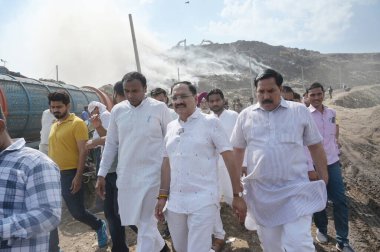 NEW DELHI, INDIA - APRIL 22, 2024: Virendra Sachdeva Delhi BJP State president visited the fire site at Gazipur Landfill area in the morning on April 22, 2024 in New Delhi, India.  (Photo by Vipin Kumar/Hindustan Times) clipart