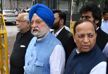 NEW DELHI, INDIA - APRIL 1, 2024: BJP delegation comprising Union Minister Hardeep Singh Puri and senior BJP leaders Arun Singh and Om Pathak leave after meeting the Election Commission of India, at Nirvachan Sadan. clipart