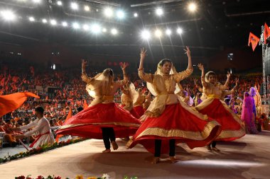 NEW DELHI, INDIA - APRIL 21:  Artists perform during Religious leaders and people gathered to celebrate Hindu Nav Varsh (Hindu New Year) organized by Delhi BJP, at Indira Gandhi Stadium, on April 21, 2024 in New Delhi, India.  clipart