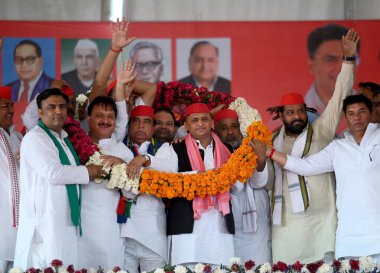 SIKANDRABAD, INDIA - APRIL 19, 2024:  Former Uttar Pradesh Chief Minister and Samajwadi Party Chief  Akhilesh Yadav along with SP Candidate of Gautam Budh Nagar Constituency  Mahendra Nagar and others SP leader, during the public rally clipart