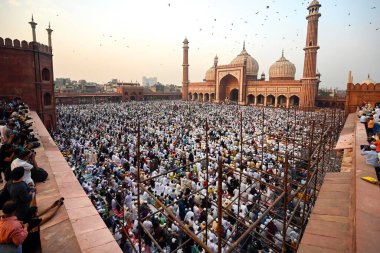 NEW DELHI, INDIA - APRIL 11, 2024: People from the Muslim community offers prayer (Namaz) on the occasion of Eid-al-Fitr at Jama Masjid,  on April 11, 2024 in New Delhi, India.  (Photo by Sanjeev Verma/Hindustan Times) clipart