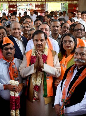 GREATER NOIDA, INDIA - APRIL 3: BJP Candidate from Gautam Budh Nagar parliamentary constituency Mahesh Sharma (Centre) filed his nomination at Surajpur Collector Office, on April 3, 2024 in Greater Noida, India.  clipart