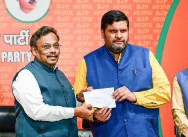 NEW DELHI, INDIA - APRIL 4: Congress National spokesperson Gourav Vallabh joins BJP in the presence of Vinod Tawde at BJP HQ at DDU Marg on April 4, 2024 in New Delhi, India.  clipart