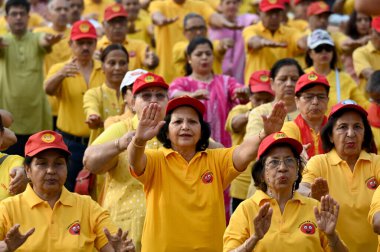 NOIDA, INDIA - APRIL 28: Retired army officers and others practice laughter yoga ahead of World Laughing Day, at Jal Vayu Vihar laughter club, sector 21, on April 28, 2024 in Noida, India. World Laughter Day  clipart