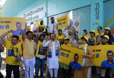 Delhi Cabinet Minister Saurabh Bharadwaj and AAP candidate for New Delhi Lok Sabha seat Somnath Bharti distribute pamphlets at Hauz Khas Metro Station Gate No 1 on April 25, 2024 in New Delhi, India. clipart