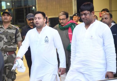 RJD leader Tejashwi Yadav speaking with media persons after the end campaign of second phase of Lok Sabha election at Jaiprakash Narayan Airport on April 27, 2024 in Patna, India.  clipart