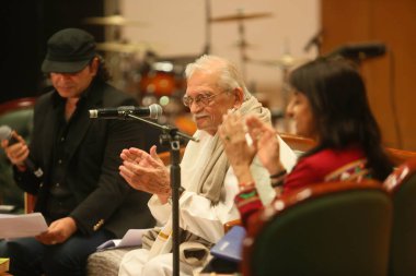 NEW DELHI, INDIA - MARCH 17, 2024: Bollywood singer Mohit Chauhan with lyricist Gulzar during the 17th Kathakar International Storytellers Festival at Delhis Bharat Mandapam, Pragati Maidan, on March 17, 2024 in New Delhi, India  clipart