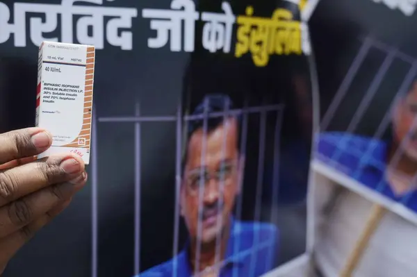 Stock image NEW DELHI, INDIA - APRIL 21, 2024: AAP party workers carrying Insulin Medicine to be given to Jail Officials during a protest dharna at Gate Number 4 of Tihar Jail