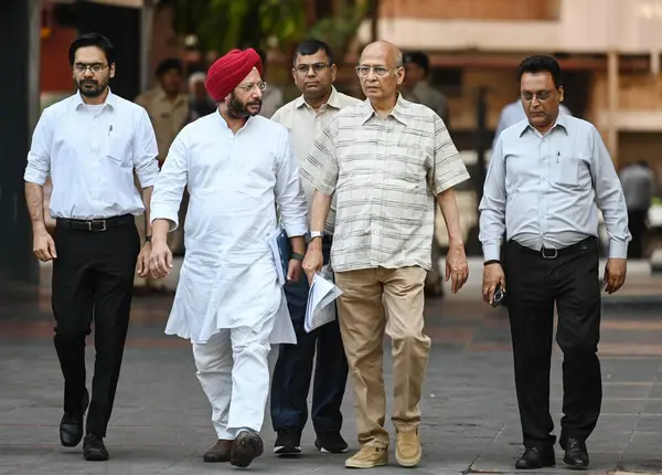 stock image NEW DELHI, INDIA - APRIL 22, 2024:  Congress Party leaders Dr Abhishek Manu Singhvi, with Gurdeep Sappal Leave after meeting ECI at Nirvachan Sadan on April 22, 2024 in New Delhi, India. 