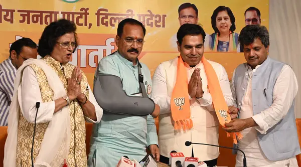 stock image NEW Delhi, INDIA - APRIL 16, 2024: Praveen Kumar son of Congress Leader Jai Kishan from West Delhi and Congress Leader Prateek Anand and other Congress Leaders joining BJP. 