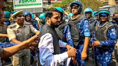 NEW DELHI, INDIA - MARCH 22, 2024: Delhi Police and Paramilitary force detain supporters of Aam Aadmi Party (AAP) as they protest against the arrest of AAP leader and Delhi's Chief Minister Arvind Kejriwal, at ITO Chowk  clipart