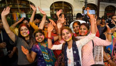 KOLKATA, INDIA - MARCH 24, 2024: The International Society for Krishna Consciousness (ISKCON) devotees celebrate Holi festival with colours and music on March 24, 2024 in Kolkata, India clipart