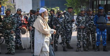 NEW DELHI, INDIA - MARCH 12, 2024: Delhi Police and Security personnel Flag march at the Seelam Pur Jaffarabad Northeast Delhi Road a day after the Ministry of Home Affairs notified the rules for implementation of the Citizenship (Amendment) Act. clipart