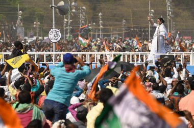 KOLKATA, INDIA - MARCH 10, 2024: Chief Minister of West Bengal and All India Trinamool Congress (AITC) Chairperson Mamata Banerjee greets TMC supporters in 'Jonogorjon' Rally and launched her party's Lok Sabha campaign at Brigade Parade Ground  clipart