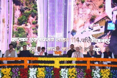 GURUGRAM, INDIA - MARCH 11:  Prime Minister Narendra Modi, Cabinet Minister Nitin Gadkari, Governor Bandaru Dattatreya, Chief Minister Manohar Lal during inaugurates the Dwarka Expressway and lay the foundation stone of Shamli-Ambala National Highway clipart