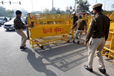 NEW DELHI, INDIA - MARCH 14, 2024: Delhi police and Gautam Buddha Nagar police force deployed at Noida-Delhi Chilla border to stop farmers rally, on March 14, 2024 in New Delhi, India. Punjab farmers have gathered at Ramlila Maidan. clipart