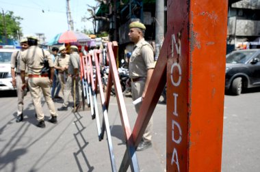 NOIDA, INDIA - MARCH 29, 2024: Noida Police personnel conducted a flag march in Sector 8 as security measures heightened following the demise of gangster-turned-politician Mukhtar Ansari, who passed away due to cardiac arrest at a hospital in Banda. clipart