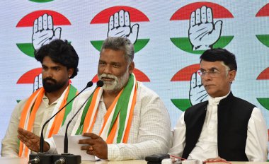 NEW DELHI, INDIA - MARCH 20:  Jan Adhikar Party chief Pappu Yadav with his son Sarthak Ranjan addresses media after joining Congress, at AICC Headquarters   on March 24, 2024 in New Delhi, India. Yadav also  merged his Jan Adhikar Party  clipart