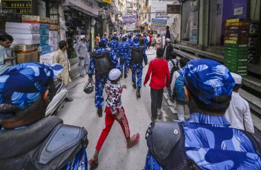 NEW DELHI, INDIA - MARCH 12, 2024: Delhi Police and Security personnel Flag march at the shaheen bagh a day after the Ministry of Home Affairs notified the rules for implementation of the Citizenship (Amendment) Act on March 12, 2024  clipart