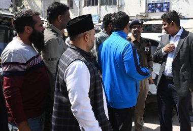 NEW DELHI, INDIA - MARCH 9, 2024: Police officials with local senior religious persons took a joint round of the locality to review the situation after yesterdays incident at Inderlok Masjid surroundings at Inderlok area. clipart