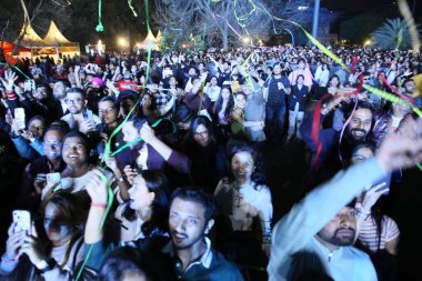 NEW DELHI, INDIA - MARCH 2, 2024: Crowds enjoy the performance of Singer-music composer Vishal Mishra during his Pehle Bhi Main India Tour, curated by Fever Live  the live entertainment vertical of Fever Network clipart