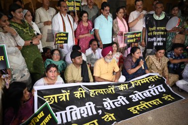 NEW DELHI, INDIA - JULY 29, 2024:  BJP councillor protest Against Delhi mayor shelly oberoi and AAP government's during the House meeting of Municipal Corporation of Delhi at civic center  on July 29, 2024 in New Delhi, India.   clipart