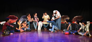 NEW DELHI, INDIA - MARCH 27: Artists performing a play Topi Shukla authored by Rahi Masoom Raza at National School of Drama, Mandi House on March 27, 2024 in New Delhi, India. Dramatic adaptation of famous novel is done by Akhtar Ali  clipart