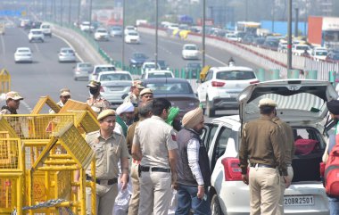 GHAZIABAD, INDIA - MARCH 14: Police officials seen checking the vehicles due to the Kisan Mahapanchayat in Delhi at Ghazipur border, on March 14, 2024 in Ghaziabad, India. Punjab farmers have gathered at Ramlila Maidan in Delhi clipart