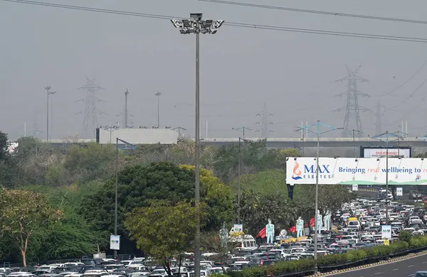 stock image NOIDA, INDIA - MARCH 14: Heavy traffic congestion was observed at the Noida-Delhi DND border, attribute to security concerns arising from ongoing Kisan Maha panchayat at Ramlila ground Delhi, on March 14, 2024 in Noida, India. 