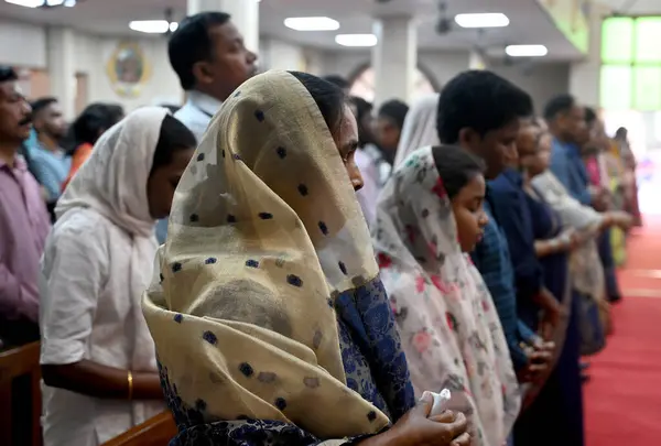 stock image NOIDA, INDIA - MARCH 31, 2024: Priest leads prayers on the occasion of Easter day inside a church at Sector-34. Easter is celebrated to mark the resurrection of Jesus Christ after his crucifixion on Good Friday.