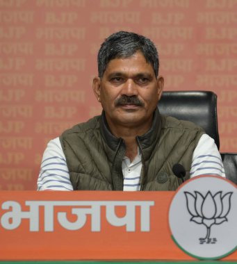 NEW DELHI, INDIA - MARCH 17: Rajendra Singh Bhandari, Congress MLA from Badrinath Assembly constituency join BJP in the presence of Uttarakhand Chief Minister Pushkar Singh Dhami and Union Minister Piyush Goel at BJP HQ at DDU Marg clipart