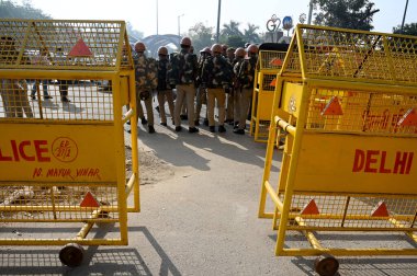 NEW DELHI, INDIA - MARCH 14, 2024: Delhi police and Gautam Buddha Nagar police force deployed at Noida-Delhi Chilla border to stop farmers rally, on March 14, 2024 in New Delhi, India. Punjab farmers have gathered at Ramlila Maidan. clipart