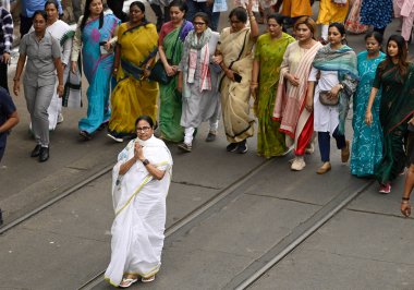 KOLKATA, INDIA - MARCH 7, 2024: Chief Minister of West Bengal Mamata Banerjee leads a rally on the eve of International Women's Day on March 7, 2024 in Kolkata, India.  clipart