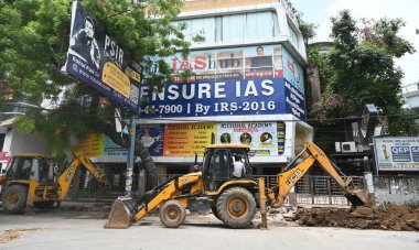 NEW DELHI, INDIA - JULY 29, 2024:  Rubble of the encroachments demolished by MCD during a drive in Old Rajinder Nagar, after three civil services aspirants died at a coaching centre due to drowning,  on July 29, 2024 in New Delhi, India. clipart