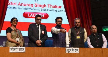 NEW DELHI, INDIA - MARCH 13, 2024: Union Minister for Information & Broadcasting and Youth Affairs & Sports Anurag Singh Thakur and Secretary, Ministry of Information and Broadcasting, Sanjay Jaju and others launching revamped websites of DD News. clipart