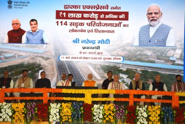 GURUGRAM, INDIA - MARCH 11:  Prime Minister Narendra Modi, Cabinet Minister Nitin Gadkari, Governor Bandaru Dattatreya, Chief Minister Manohar Lal during inaugurates the Dwarka Expressway and lay the foundation stone of Shamli-Ambala National Highway clipart