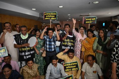 NEW DELHI, INDIA - JULY 29, 2024:  BJP councillor protest Against Delhi mayor shelly oberoi and AAP government's during the House meeting of Municipal Corporation of Delhi at civic center  on July 29, 2024 in New Delhi, India.   clipart