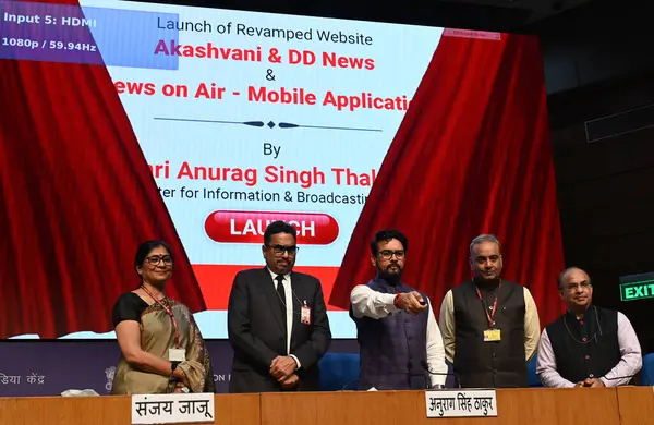 stock image NEW DELHI, INDIA - MARCH 13, 2024: Union Minister for Information & Broadcasting and Youth Affairs & Sports Anurag Singh Thakur and Secretary, Ministry of Information and Broadcasting, Sanjay Jaju and others launching revamped websites of DD News.