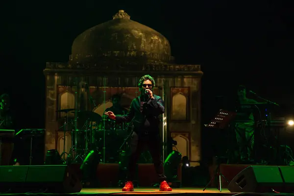 stock image NEW DELHI, INDIA - MARCH 4, 2024: Singer Javed Ali performs during a concert organized by Delhi Tourism at Sunder Nursery