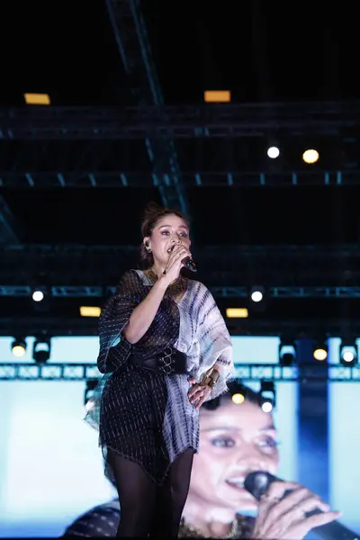 stock image NEW DELHI, INDIA - MARCH 2 2024: Bollywood singer Sunidhi Chauhan performs during an annual tech fest - Moksha - Innovision at Netaji Subhas University of Technology (NSUT)