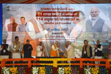 GURUGRAM, INDIA - MARCH 11:  Prime Minister Narendra Modi, Cabinet Minister Nitin Gadkari, Governor Bandaru Dattatreya, Chief Minister Manohar Lal during inaugurates the Dwarka Expressway and lay the foundation stone of Shamli-Ambala National Highway clipart