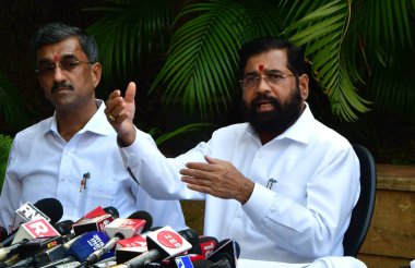 MUMBAI, INDIA - MARCH 18, 2024: Maharashtra CM Eknath Shinde addressing the media, in the presence of Shivsena (Shinde faction) leader Shambhuraj Desai, Shivsena (Shinde faction) leader Uday Samant on March 18, 2024 in Mumbai, India. clipart