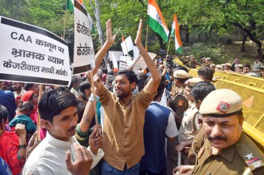 NEW DELHI, INDIA - MARCH 14: Hindu and Sikh refugees raise slogans during a protest against Delhi Chief Minister Arvind Kejriwal demanding an apology from him over his statements against the implementation of the Citizenship (Amendment) Act (CAA) clipart