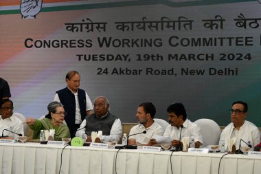 NEW DELHI, INDIA - MARCH 19, 2024: Congress President Mallikarjun Kharge, Sonia Gandhi, Rahul Gandhi, KC Venugopal and other members during the Congress Working Committee (CWC) meeting, at AICC, HQ  clipart