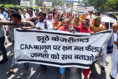 NEW DELHI, INDIA - MARCH 14: Hindu and Sikh refugees raise slogans during a protest against Delhi Chief Minister Arvind Kejriwal demanding an apology from him over his statements against the implementation of the Citizenship (Amendment) Act (CAA) clipart