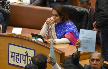 NEW DELHI, INDIA - FEBRUARY 7:  Opposition party councillors protest in front of Delhi Mayor Shelly Oberoi inside the Municipal Corporation of Delhi (MCD) c during the Special Meeting on the Revised Budget Estimates 2023-24, at the Shyama Prasad  clipart