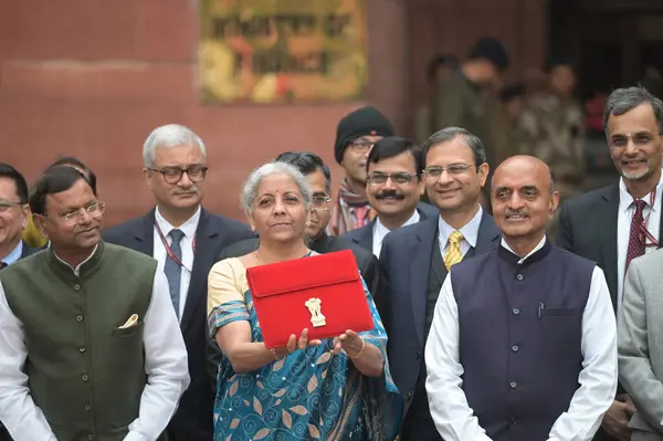 stock image NEW DELHI, INDIA - FEBRUARY 1, 2024: Union Finance Minister Nirmala Sitharaman along with MoS Finance Pankaj Choudhary, Bhagwat Kishanrao Karad and other Team members carrying a folder-case containing the Interim Budget 2024 