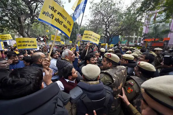 Stock image NEW DELHI, INDIA - FEBRUARY 2, 2024 Police personnel stop AAP supporters during a protest, against the BJP for alleged rigging the Chandigarh Mayoral election at DDU Marg near BJP office on February 2, 2024 in New Delhi, India. 